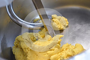 pasta dough mixed in a professional kneader