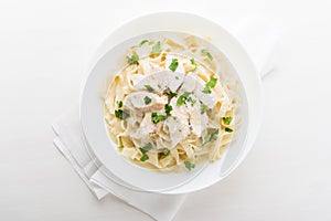 Pasta fettuccine alfredo with chicken, parmesan and parsley