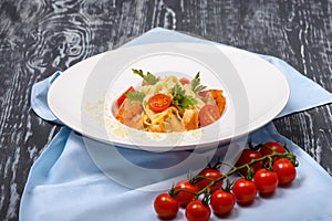 Pasta fetuccine with shrimp, tomatoes, parsley, tomatoes and parmesan. Traditional Italian cuisine 