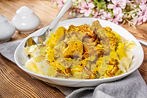 Pasta with fried chicken in cream and chanterelle sauce