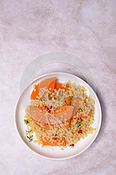 Pasta with fried pumpkin slices