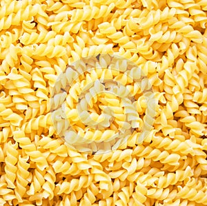 Pasta fusili as background