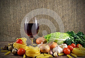 Pasta and glass of wine on the table