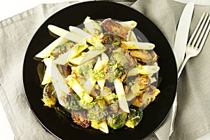 Pasta with green vegetables roasted brussel sprouts and pesto sauce