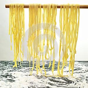 Pasta hanging to dry in the kitchen