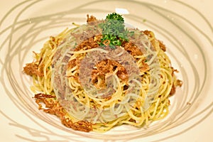 Pasta homemade, Spaghetti aglio e olio with spicy corn beef. photo