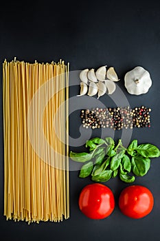 Pasta ingredients concept on black background