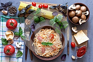 Pasta and ingredients for its preparation. Italian food concept. Top view, copy space