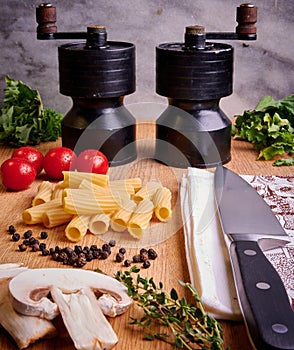 Pasta Ingredients with Salt and Pepper Grinders