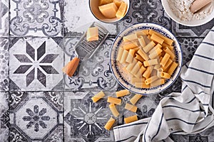 Pasta. italian pasta. Rigatoni and vegetables cooking ingredients on an old stone background. Italian food cooking ingredients. To