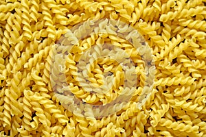 Pasta italian spiral background  uncooked dry pasta