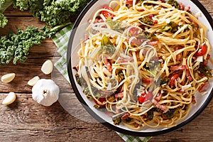 Pasta Linguine with cabbage kale, bacon, tomatoes and parmesan c
