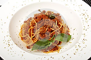 Pasta with meat, tomato sauce, parmesan and vegetables