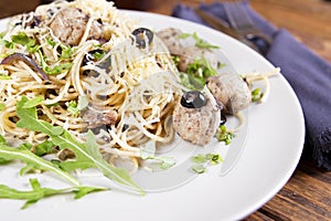 Pasta with meatballs, anchovies and olives.