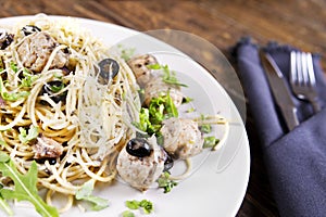 Pasta with meatballs, anchovies and olives.