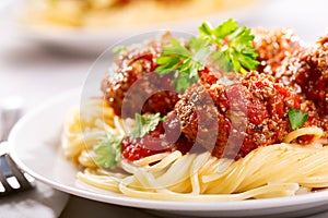 Pasta with meatballs and parsley