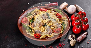 Pasta with mushrooms, cheese, spinach, rukkola and cherry tomatoes