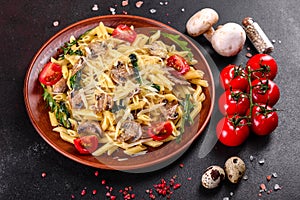 Pasta with mushrooms, cheese, spinach, rukkola and cherry tomatoes