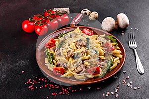 Pasta with mushrooms, cheese, spinach, rukkola and cherry tomatoes