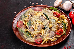 Pasta with mushrooms, cheese, spinach, rukkola and cherry tomatoes