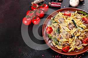 Pasta with mushrooms, cheese, spinach, rukkola and cherry tomatoes