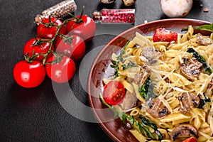 Pasta with mushrooms, cheese, spinach, rukkola and cherry tomatoes