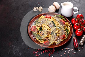 Pasta with mushrooms, cheese, spinach, rukkola and cherry tomatoes