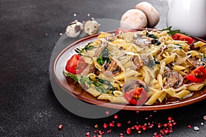 Pasta with mushrooms, cheese, spinach, rukkola and cherry tomatoes