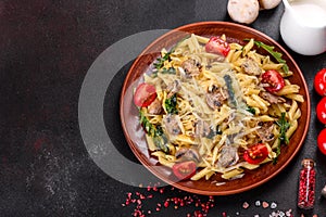 Pasta with mushrooms, cheese, spinach, rukkola and cherry tomatoes