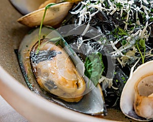 pasta with octopus ink and bivalves photo