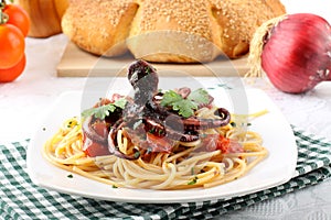 Pasta with octopus and tomato