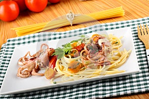 Pasta with octopus, tomatoes and carrots