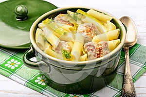 Pasta penne with meatballs leek and cheese sauce.