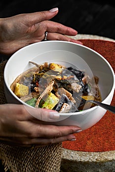 Pasta pizzoccheri with chinese cabbage, potato on dark background. italian traditional dish