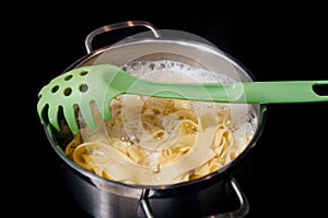 pasta in pot on the induction cooking hob