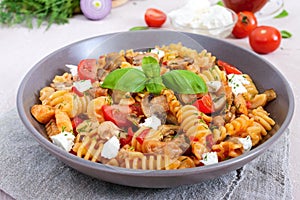 Pasta Radiatori with chicken, mushrooms, cherry tomatoes, feta cheese and tomato sauce