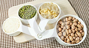 Pasta, Rice, Peanuts and Mung Beans in Measuring Cups