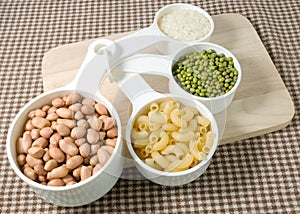 Pasta, Rice, Peanuts and Mung Beans in Measuring Cups