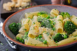 Pasta rigatoni with broccoli and green peas. Vegan menu.