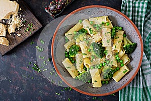 Pasta rigatoni with broccoli and green peas. Vegan menu. Dietary food. Flat lay.