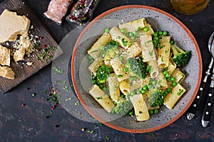 Pasta rigatoni with broccoli and green peas. Vegan menu. Dietary food. Flat lay.