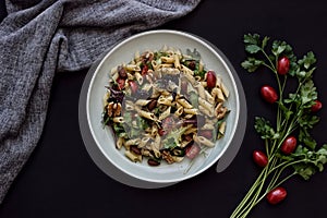 Pasta salad dish on dark background