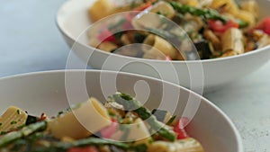 Pasta salad with grilled vegetables, zucchini, eggplant, asparagus and tomatoes.