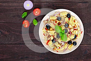 Pasta salad radiatori with chicken, black olives, blue onion, sweet pepper