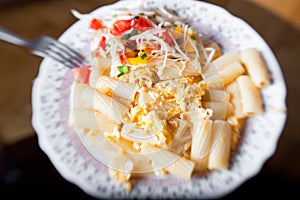 Pasta with salad from tomato and cabbage