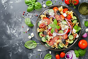 Pasta salad with tomatoes, cucumbers, olives, mozzarella and red onion Greek style