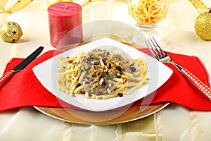 Pasta with sardines and fennel on Christmas table