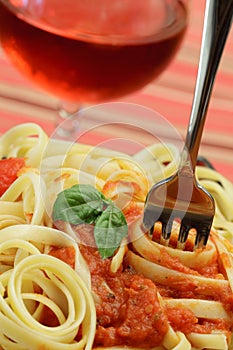 Pasta With Sauce and A Basil Leaf