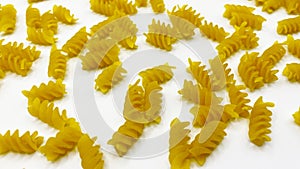 Pasta in the shape of a spiral. Macro photo of pasta. Pasta background. Pasta in bulk