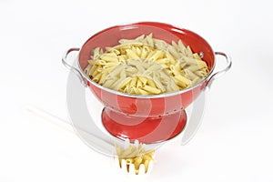 Pasta shells in colander